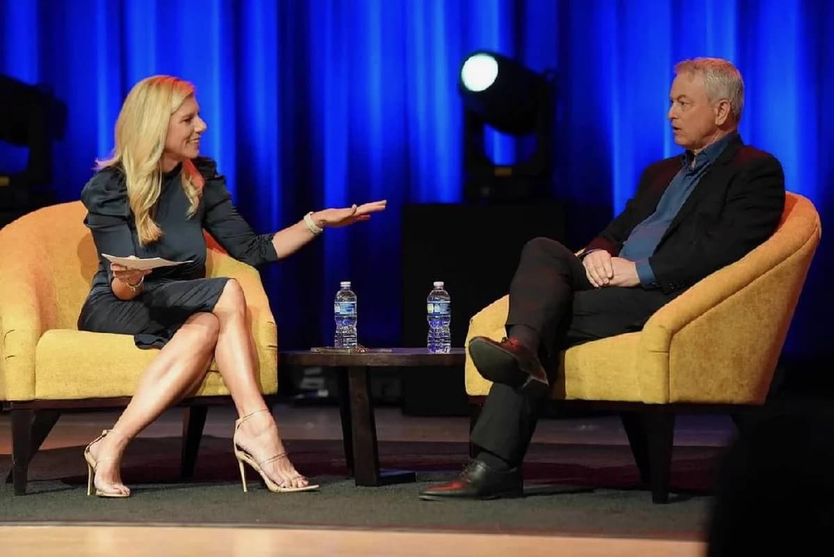 Molly Grantham leading a fireside conversation on stage